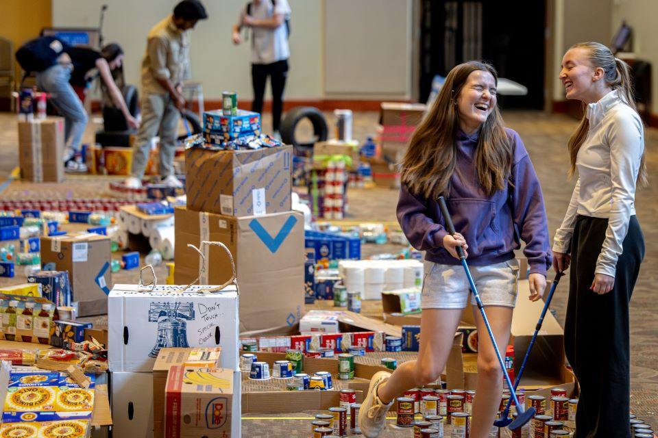 Students play minature golf with non-perishable food