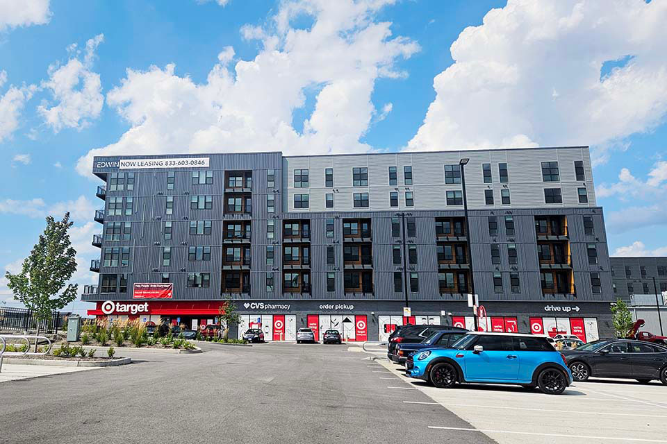 An apartment building with a small target store located on the first level.