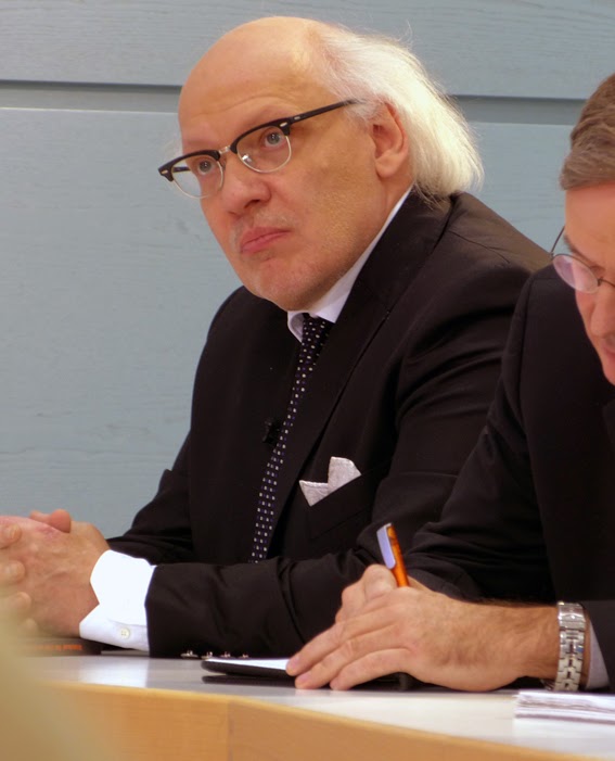 Image of keynote speaker sitting at a table.