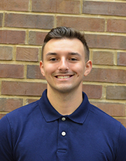 Noah Hensley poses for a photo at the Chaifetz School of Business