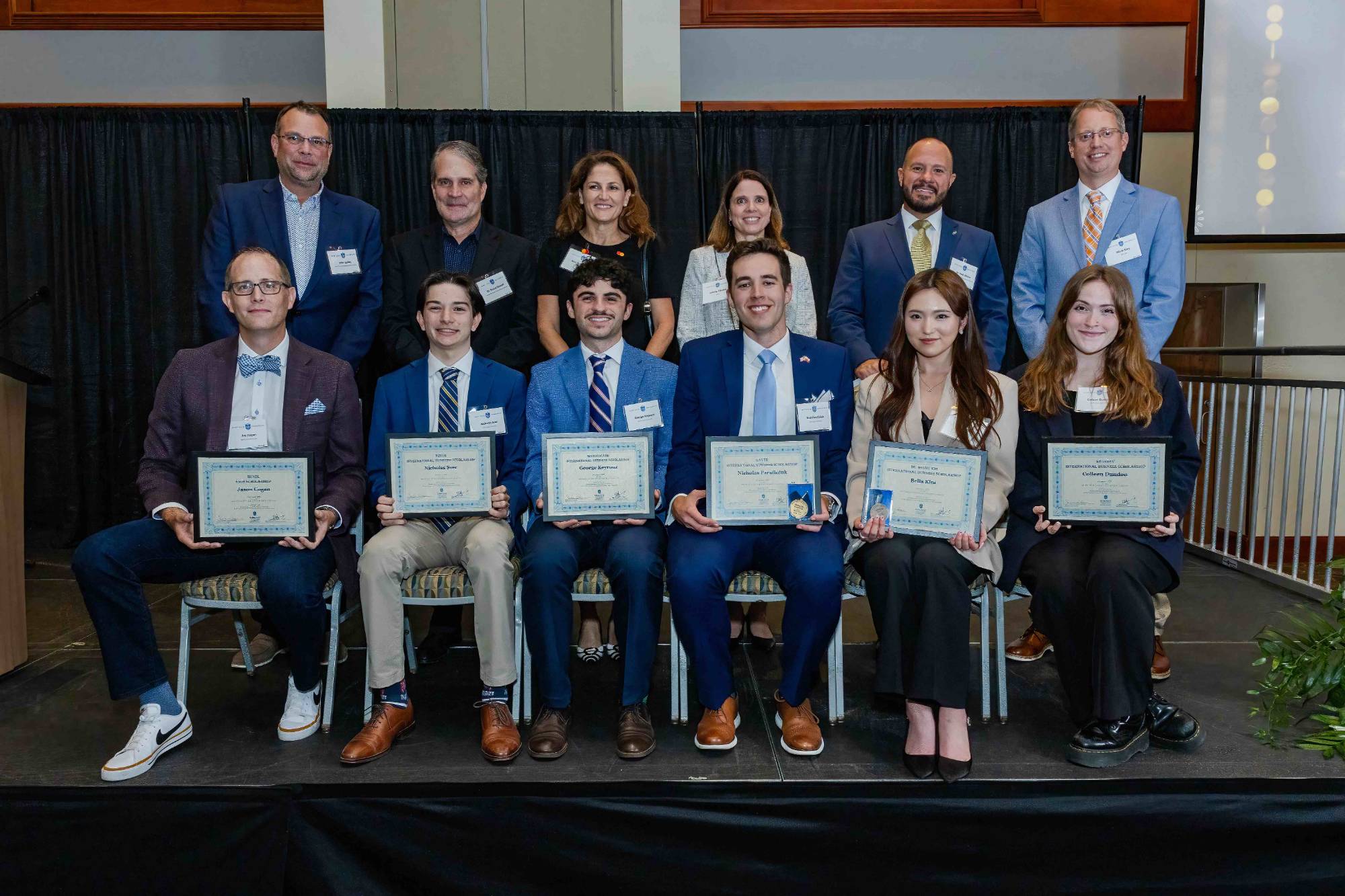 2025 International Business Awards Honorees Pose On Stage for a Group Photo with their Awards