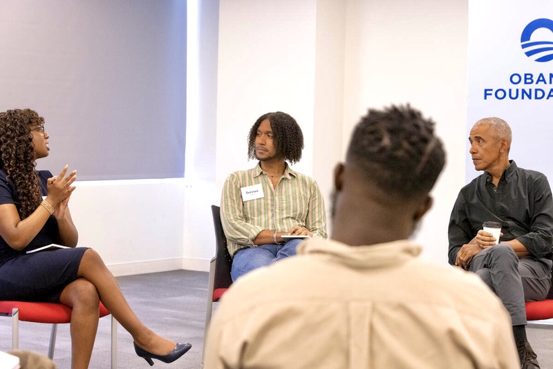 SLU student Faith Townsell, left, speaks with former President Barack Obama.