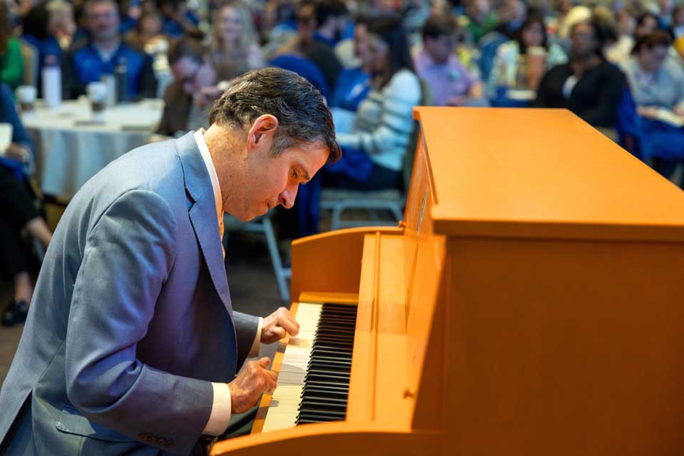 a man playing a piano