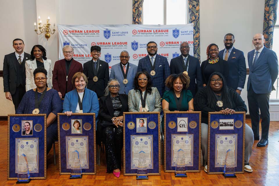 people sit with awards