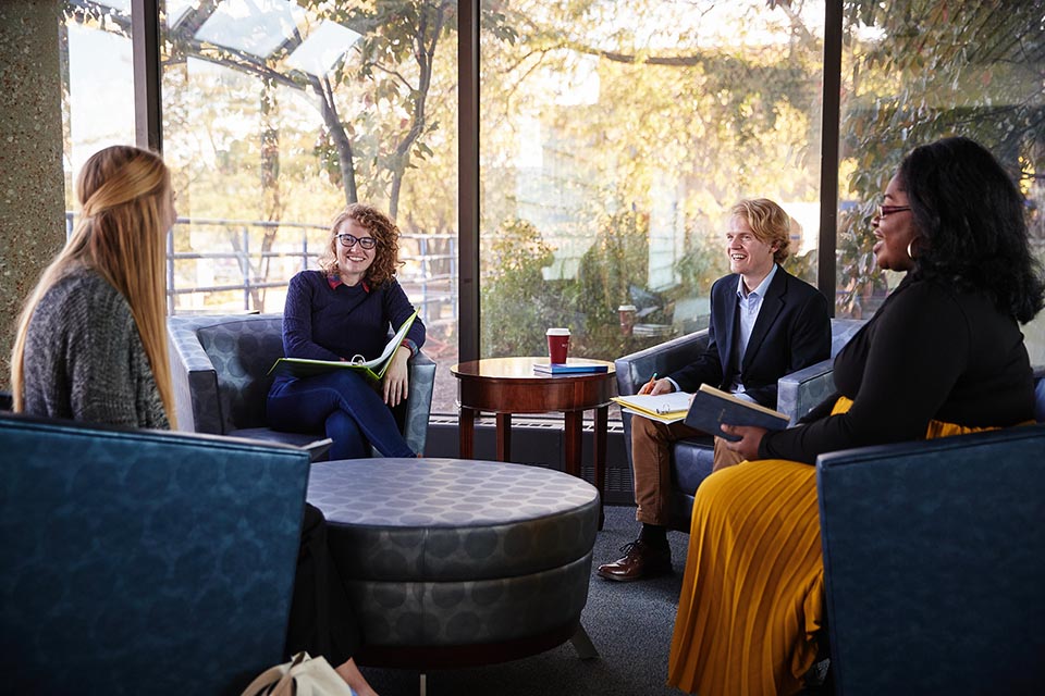 Public health students meeting around table