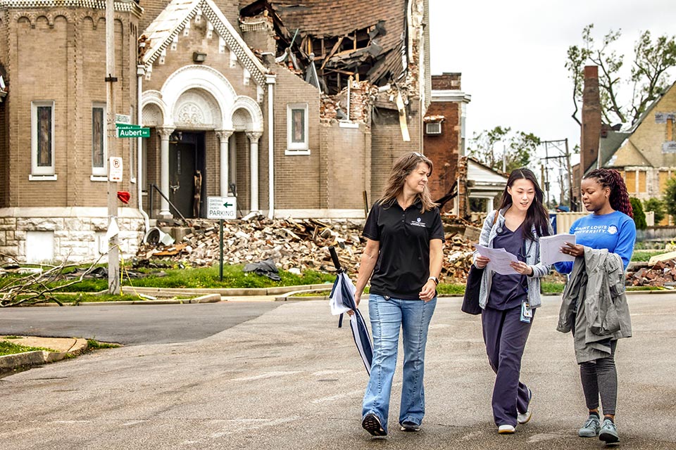SLU faculty and staff during tornado cleanup in St. Louis